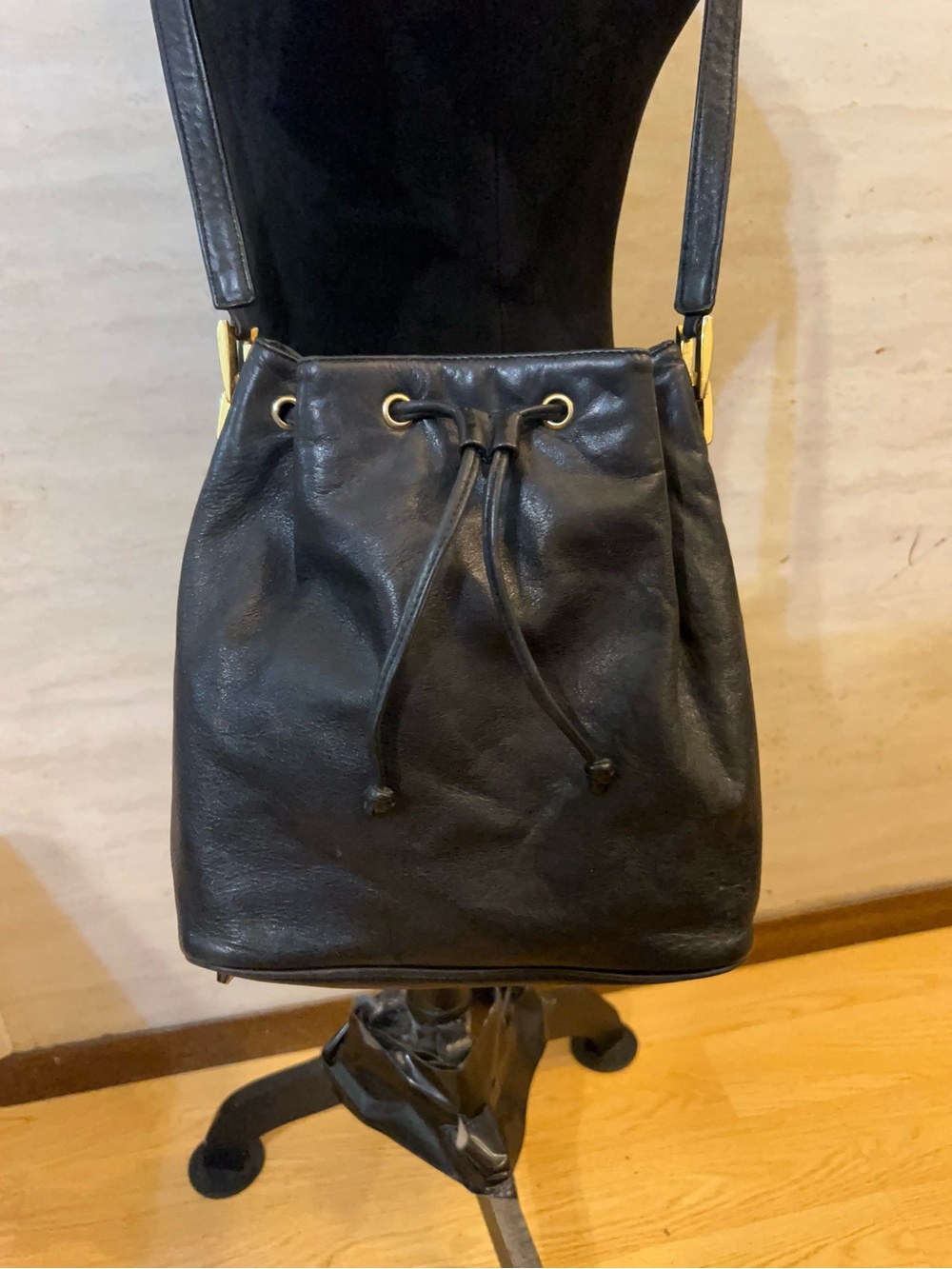 Vintage Dillard's black leather drawstring bucket bag.